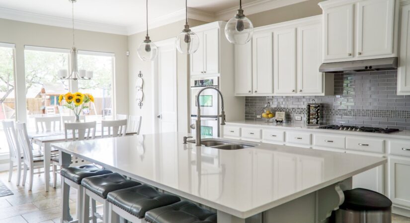 White kitchen island with bar stools.